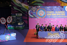 At the lighting ceremony, officiating guests kick off the finals of the Hong Kong Open Badminton Championships.