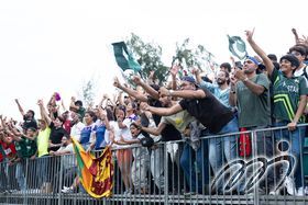 Fans cheering enthusiastically during the Cup Finals.