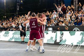 Latvia team players celebrate after they got the ticket to Paris