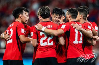 Hong Kong, China players celebrated together after scoring.