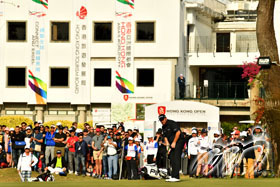 Shane Lowry (Rep. of Ireland) putts on the 18th Green in front of a large crowd