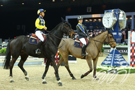 Local rider Vincent HO (left) teams up with Jacqueline LAI (right), member of the HKJC Equestrian Team, to compete for the championship title in the home stadium.