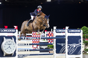 Hong Kong rider Jacqueline LAI demonstrates a fantastic performance in jumping over the fence.