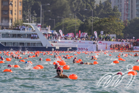 An unprecedented scale of swimmers are swimming hard across Victoria Harbour to their destination at Quarry Bay Park Public Pier.