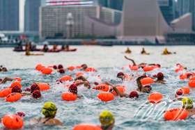 Leisure group swimmers were wearing tow floats, to swim across the Victoria Harbour.