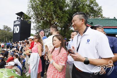 Secretary for Culture, Sports and Tourism Rosanna Lau and Hong Kong Golf Club Vice-Captain Bryant Lu watch the action at the 10th hole