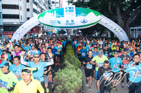 When the air horn is sounded, runners start the marathon race of 42.195km at Tsim Sha Tsui.