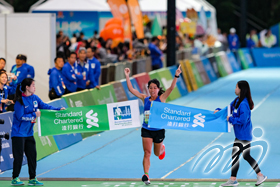 Local elite runner Christy Yiu kit-Ching wins the women's half marathon in a time of 1:16:29. Local elite runner Christy Yiu kit-Ching wins the women's half marathon in a time of 1:16:29.