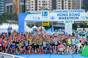 Sub-3 marathon runners gather at Finish Area for group photo showing remarkable excitement.