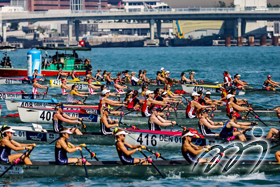 16 boats in the Finals A of the Coastal Women's Coxed Quadruple Sculls off the start line