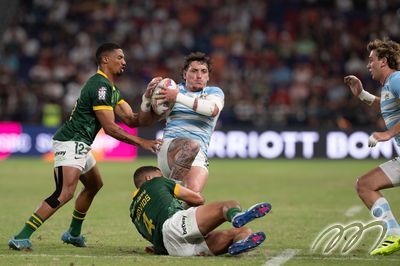 The South African defender makes a tackle on the Argentina attacker in Sunday's Men's Cup Final