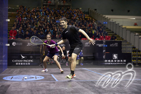 U.S Open Champion, Nour El Tayeb (behind) and Hong Kong player Lee Ho Yin Max (front) are playing together in an exhibition match for juniors before the finals begin.