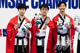 The third-place winners in the Recognized Poomsae Male Team U30 - the Hong Kong, China Taekwondo Poomsae Team (From left) LIU Ho Yin, LUI Ching Nam, and CHAN Chung Yin