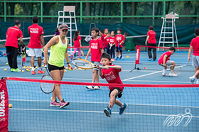 Lauren Davis is conducting a tennis clinic on the Kid's Day.