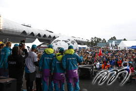 A celebratory moment among members of Team AkzoNobel prevails on the stage as they are receiving their first place award for the HGC In-Port Race. A celebratory moment among members of Team AkzoNobel prevails on the stage as they are receiving their first place award for the HGC In-Port Race.