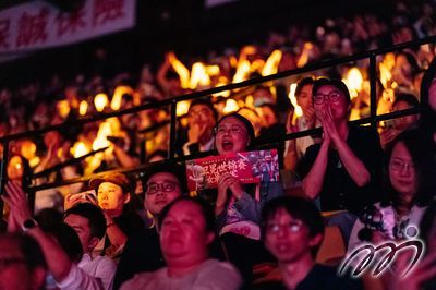 Passionate fans cheer for the athletes.