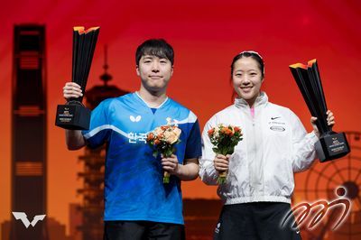 WTT Finals Hong Kong 2025 mixed doubles champions LIM Jong-hoon and SHIN Yu-bin celebrate together, with the Coliseum witnessing their triumph.