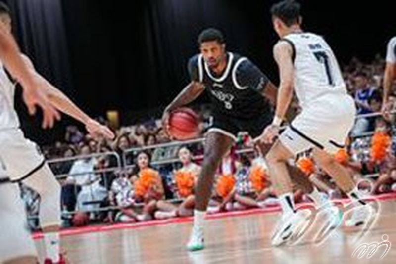 Paul George dribbles